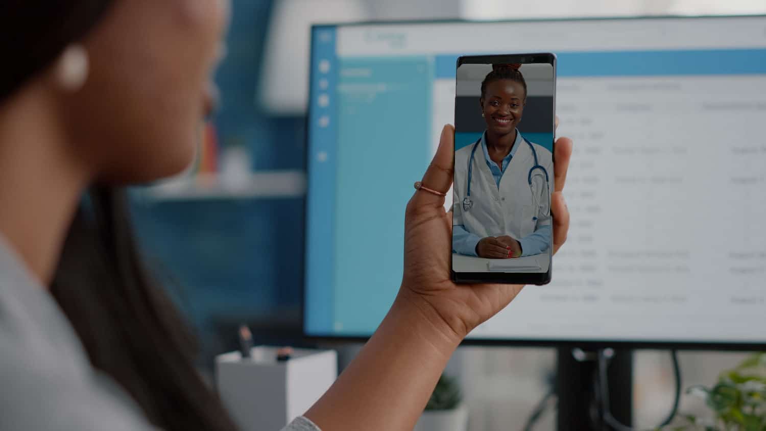 Doctor consulting with patient via video call